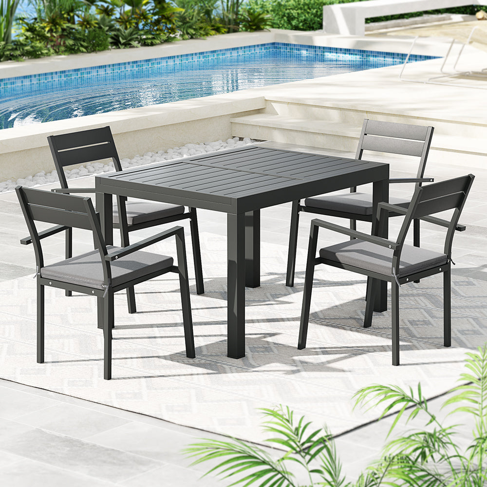 Modern outdoor dining set with 4 chairs by poolside, perfect for Australian backyard entertaining