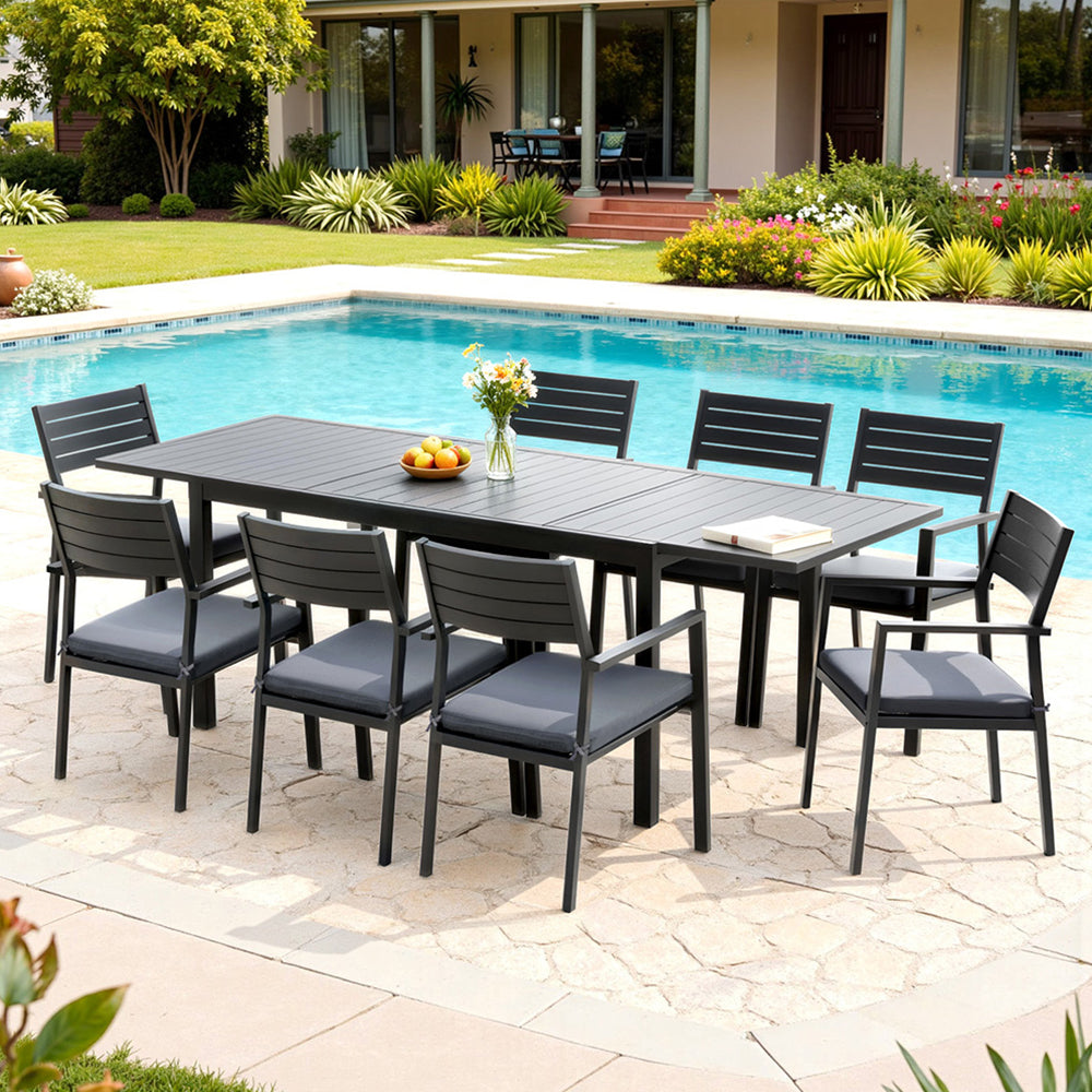 Black outdoor dining set with 8 chairs by poolside, perfect for Australian backyard entertaining