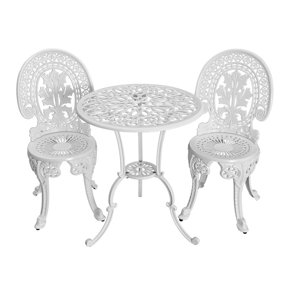 White ornate metal bistro set with round table and two chairs for outdoor patio or garden use