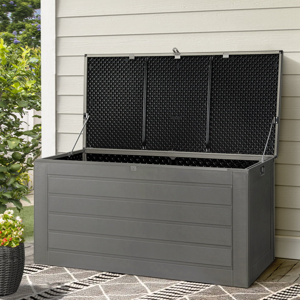 Grey outdoor storage box with lid open, perfect for patio or garden use