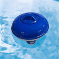 Blue floating pool chlorinator dispenser in clear water, ideal for pool maintenance and backyard care
