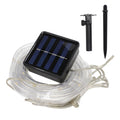 Solar-powered outdoor string lights with solar panel, stakes, and mounting bracket for garden or patio lighting